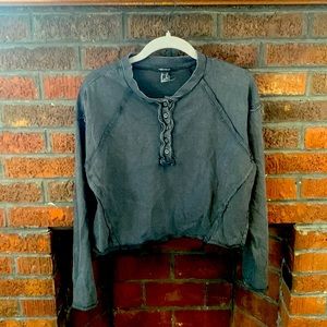 Distressed gray long sleeve cropped top. 3/4 button up. Size medium.
